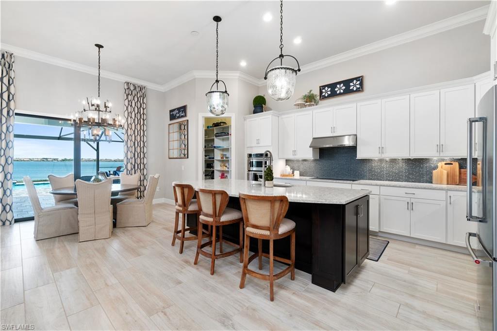 14367 Pine Hollow Drive Estero, FL 33928 - Photo 12 of 50 a kitchen with a counter space cabinets and appliances