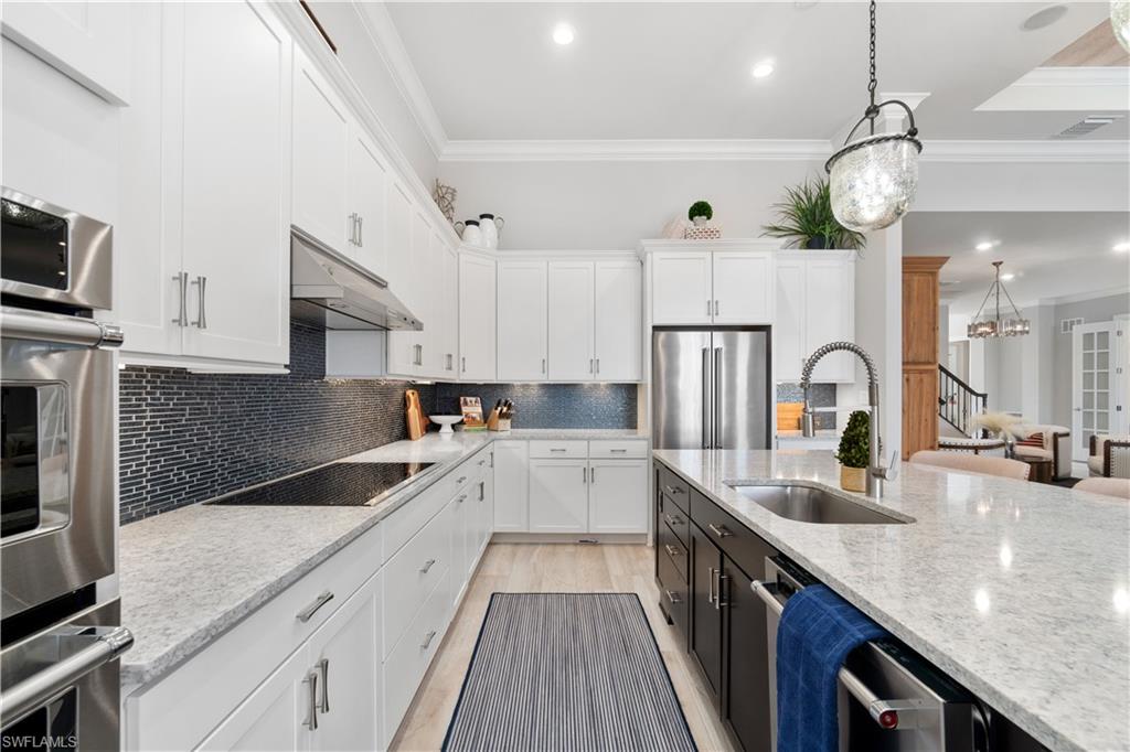 14367 Pine Hollow Drive Estero, FL 33928 - Photo 14 of 50 a view of a kitchen with a sink and cabinets