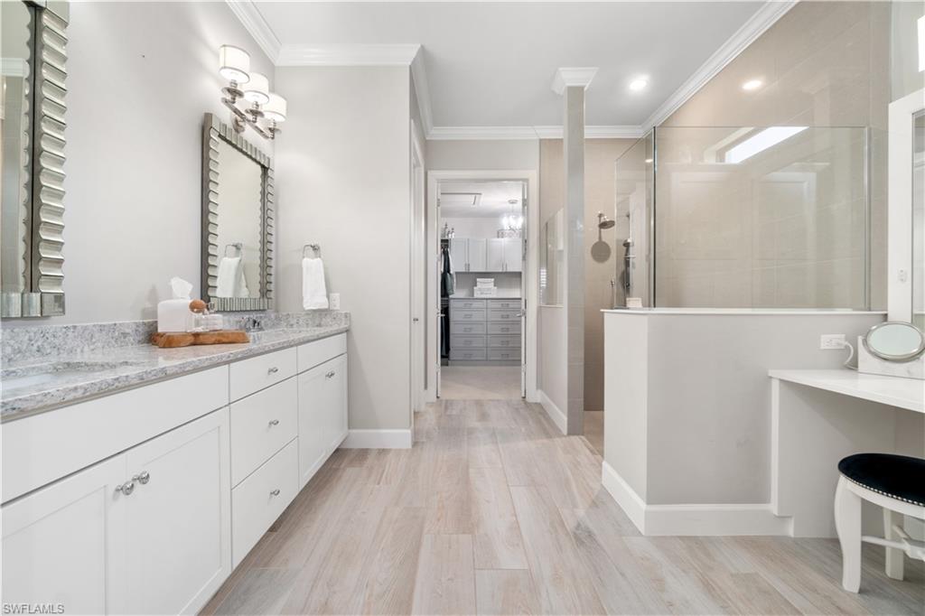 14367 Pine Hollow Drive Estero, FL 33928 - Photo 24 of 50 a bathroom with a double vanity sink and a mirror