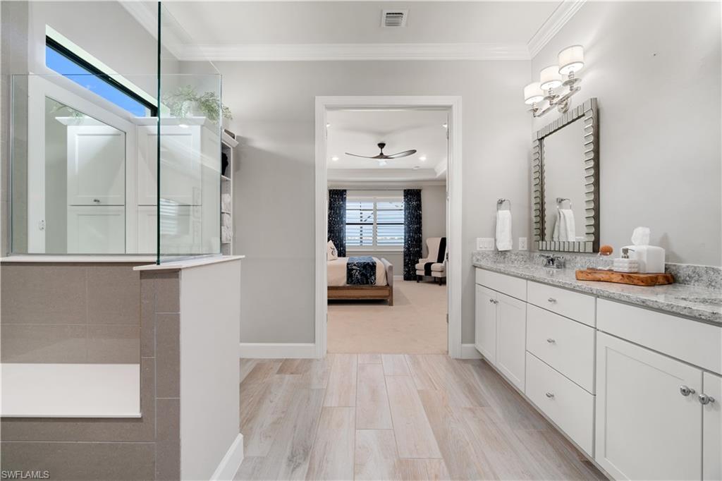 14367 Pine Hollow Drive Estero, FL 33928 - Photo 26 of 50 a spacious bathroom with a double vanity sink a mirror and a shower
