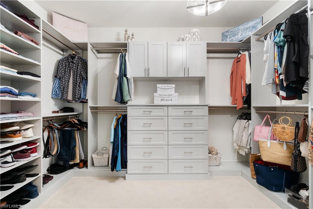 14367 Pine Hollow Drive Estero, FL 33928 - Photo 27 of 50 a view of walk in closet with clothes and shoes
