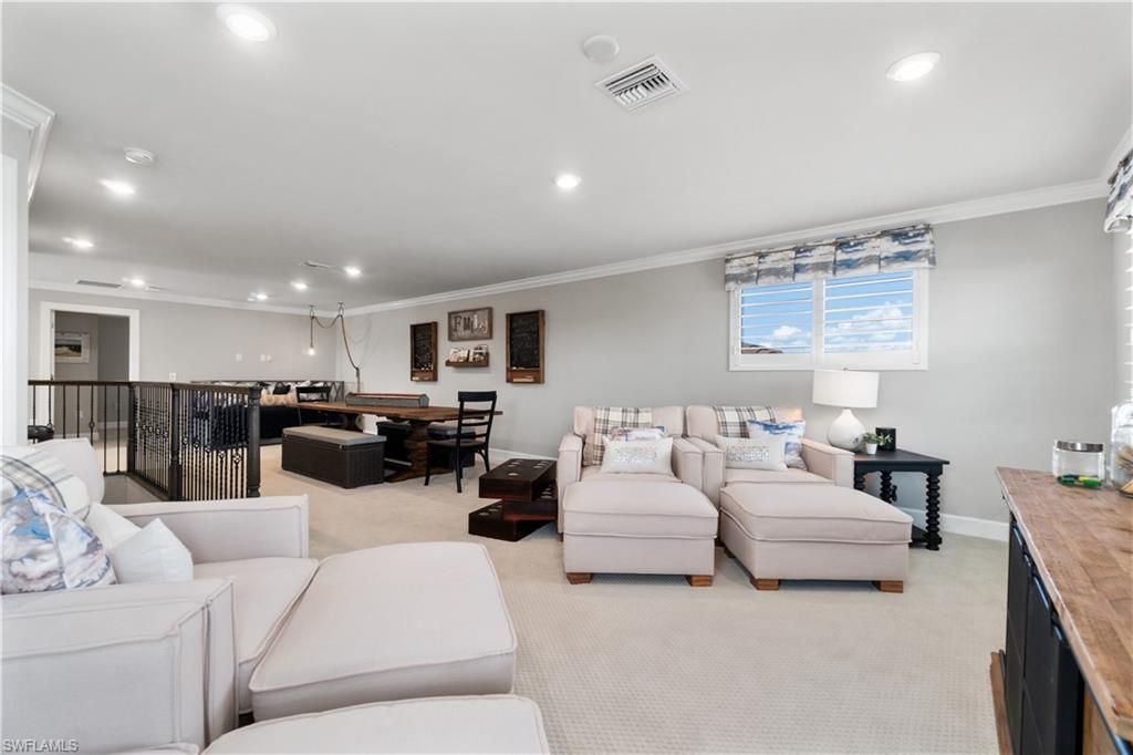 14367 Pine Hollow Drive Estero, FL 33928 - Photo 29 of 50 a living room with furniture and a view of kitchen