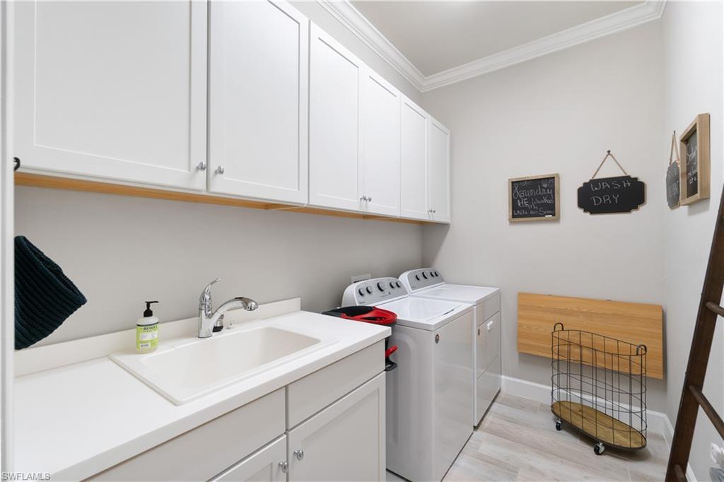 14367 Pine Hollow Drive Estero, FL 33928 - Photo 34 of 50 a utility room with dryer and washer