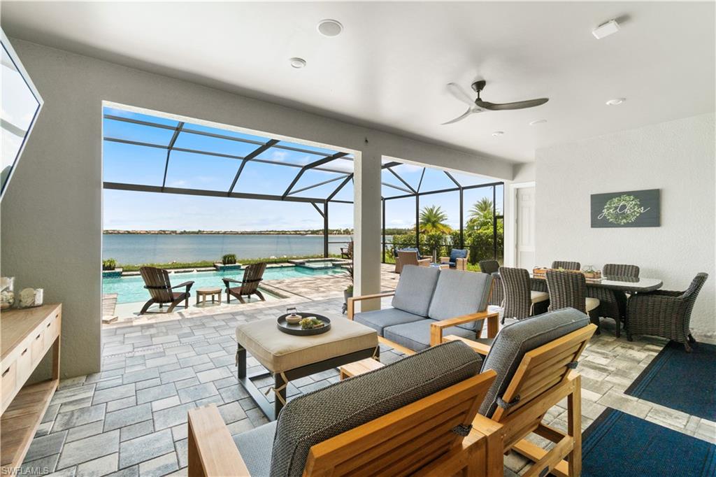 14367 Pine Hollow Drive Estero, FL 33928 - Photo 35 of 50 a living room with furniture a rug and a large window