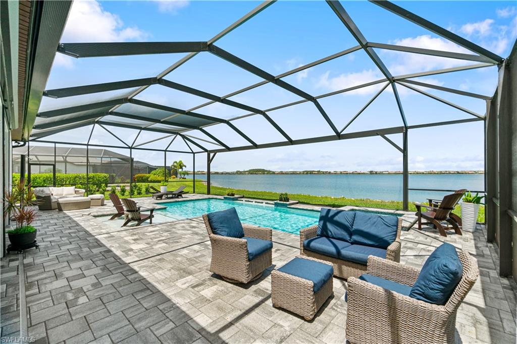 14367 Pine Hollow Drive Estero, FL 33928 - Photo 41 of 50 a view of couch and chairs under an umbrella