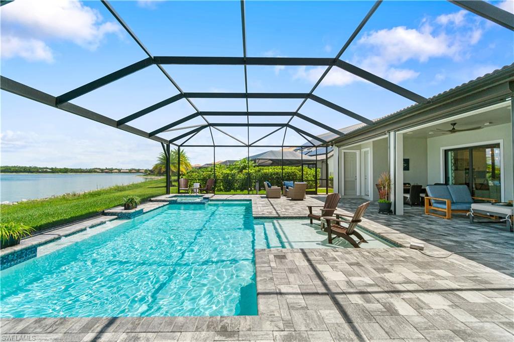 14367 Pine Hollow Drive Estero, FL 33928 - Photo 42 of 50 a view of swimming pool with outdoor seating and yard