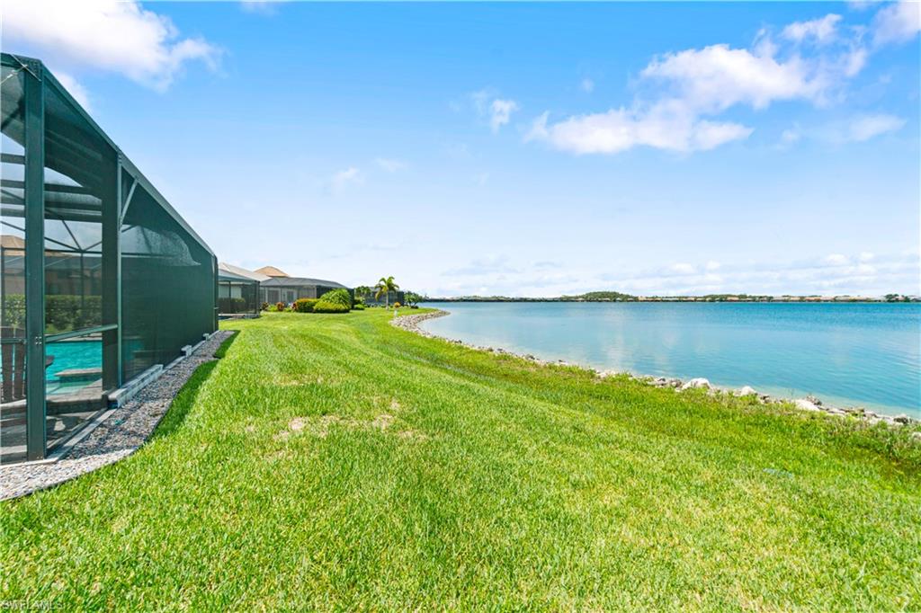 14367 Pine Hollow Drive Estero, FL 33928 - Photo 43 of 50 a view of a lake with a big yard