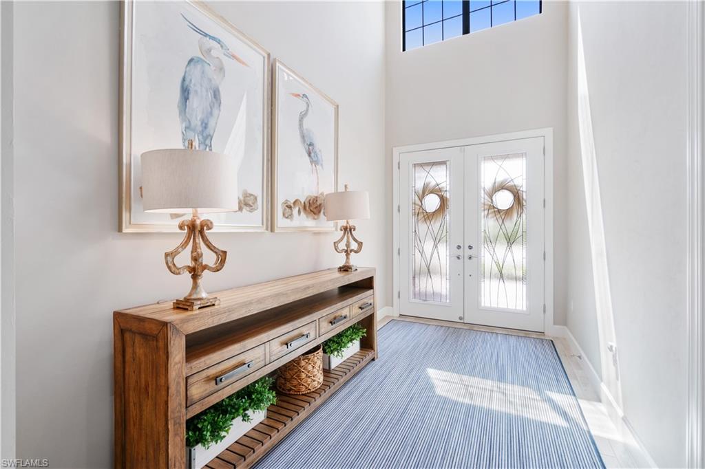 14367 Pine Hollow Drive Estero, FL 33928 - Photo 5 of 50 a hallway with a large window