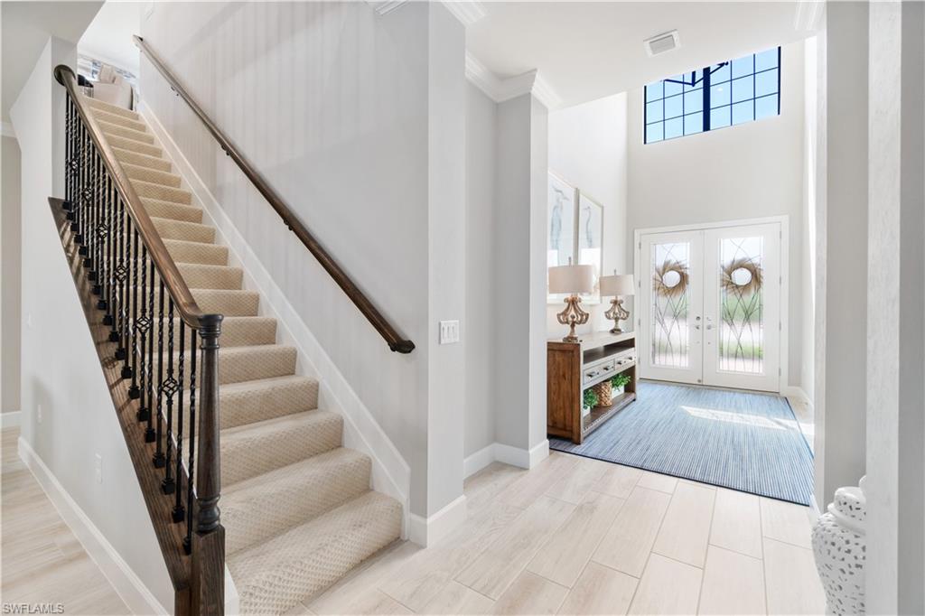 14367 Pine Hollow Drive Estero, FL 33928 - Photo 6 of 50 a view of a hallway with wooden floor and entryway