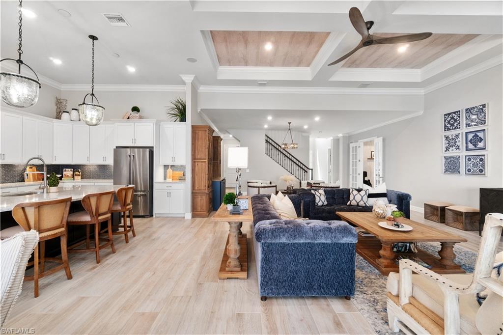 14367 Pine Hollow Drive Estero, FL 33928 - Photo 8 of 50 a living room with lots of furniture and kitchen view