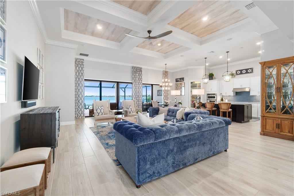 14367 Pine Hollow Drive Estero, FL 33928 - Photo 10 of 50 a living room with furniture and a flat screen tv