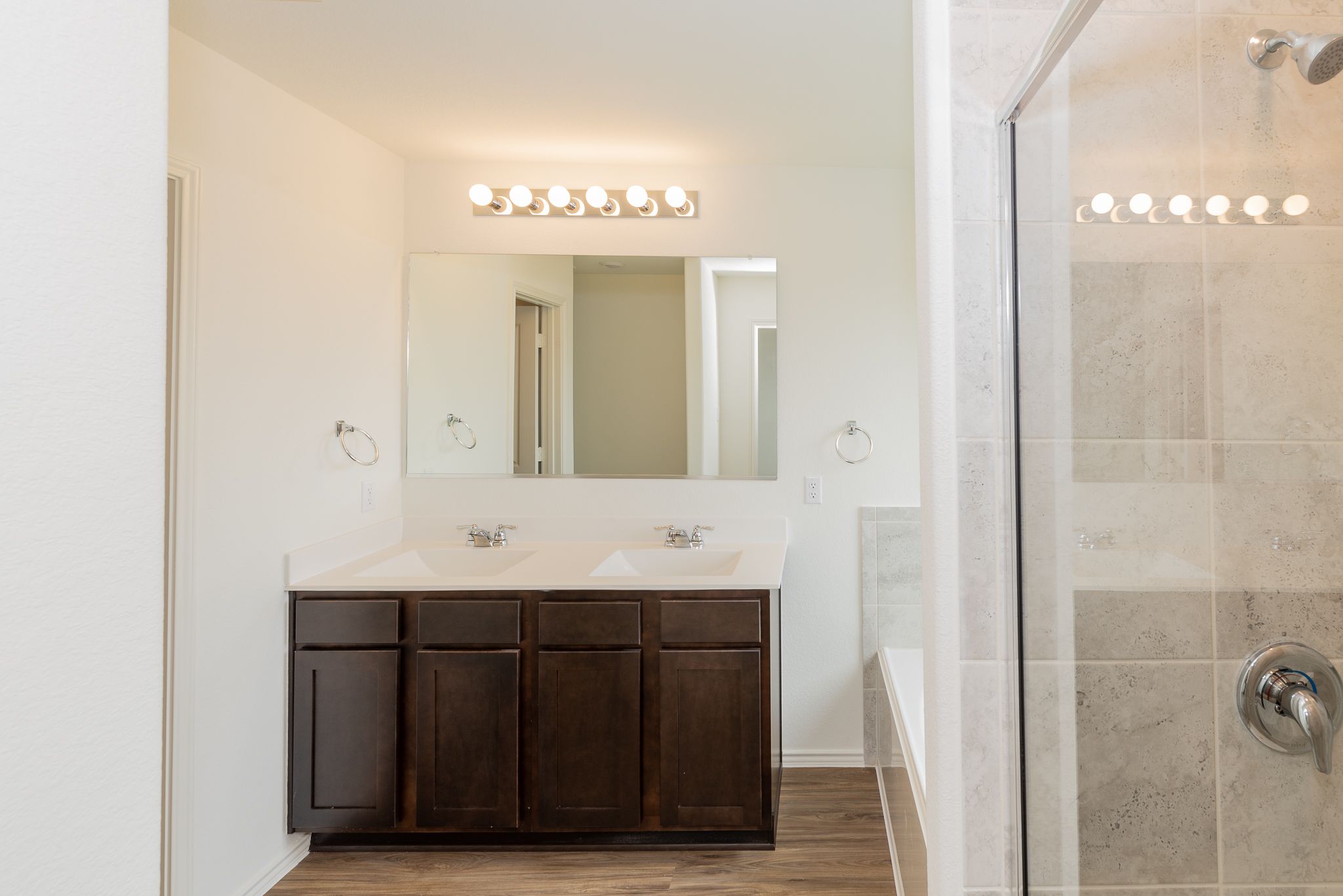 509 Greatest Gift Way Jarrell, TX 76537 - Photo 20 of 28 a bathroom with a sink a mirror and a shower