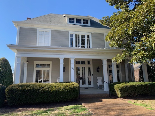 618 General George Patton Road Nashville, TN 37221 - Photo 20 of 26 a view of a white house with large windows and plants