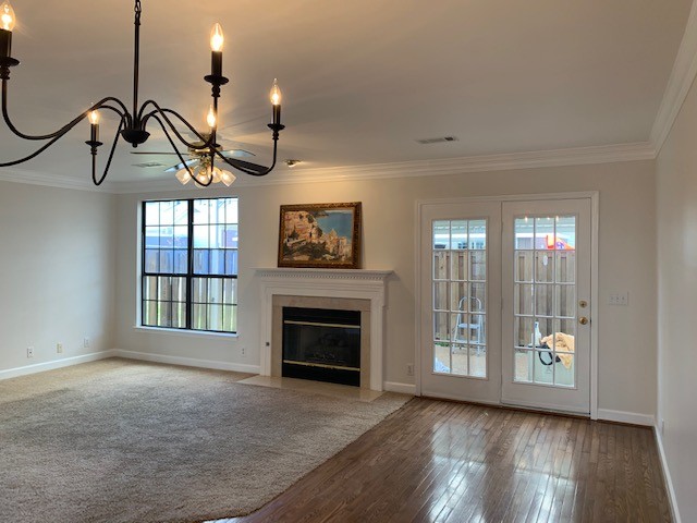 618 General George Patton Road Nashville, TN 37221 - Photo 4 of 26 an empty room with windows cabinet and fireplace