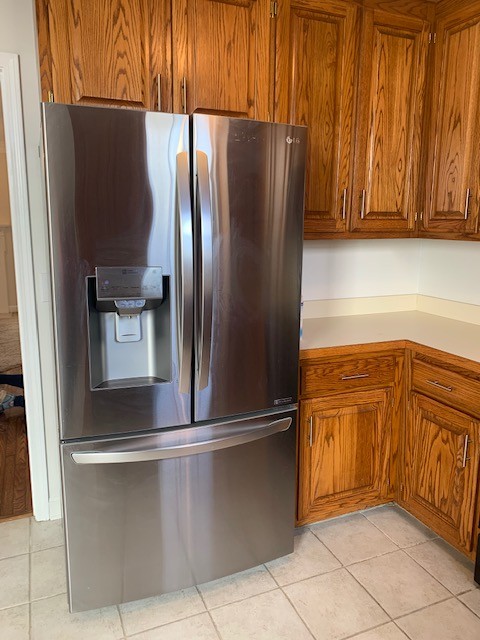618 General George Patton Road Nashville, TN 37221 - Photo 8 of 26 a kitchen with stainless steel appliances granite countertop a refrigerator and a sink
