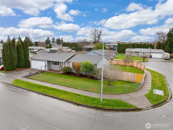 a view of a playground with a house