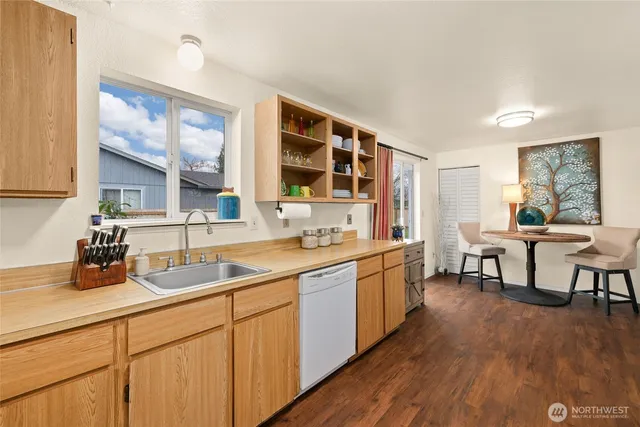 a kitchen with a sink and cabinets