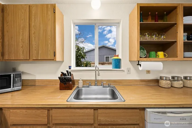 a kitchen with sink and window