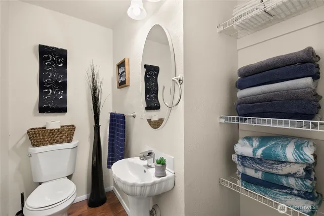a bathroom with a toilet sink and shower