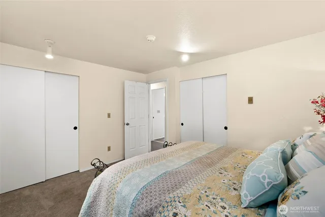 a bedroom with a bed and a closet