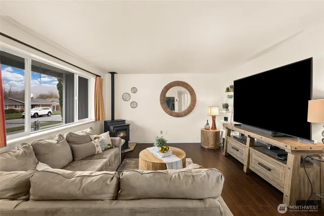 a living room with furniture and a flat screen tv