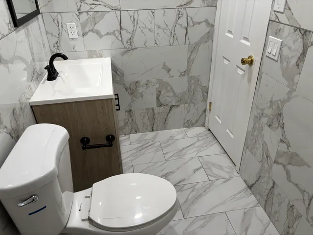 a bathroom with a sink and toilet