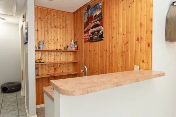 a room with a door and a cabinet
