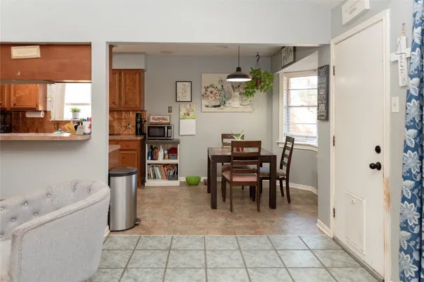 a dining room with furniture and window