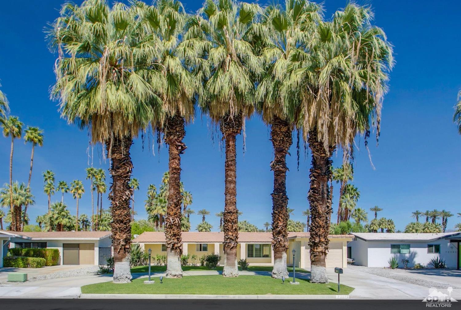 70070 Chappel Road Rancho Mirage, CA 92270 - Photo 1 of 32 a couple of palm trees sitting in front of house