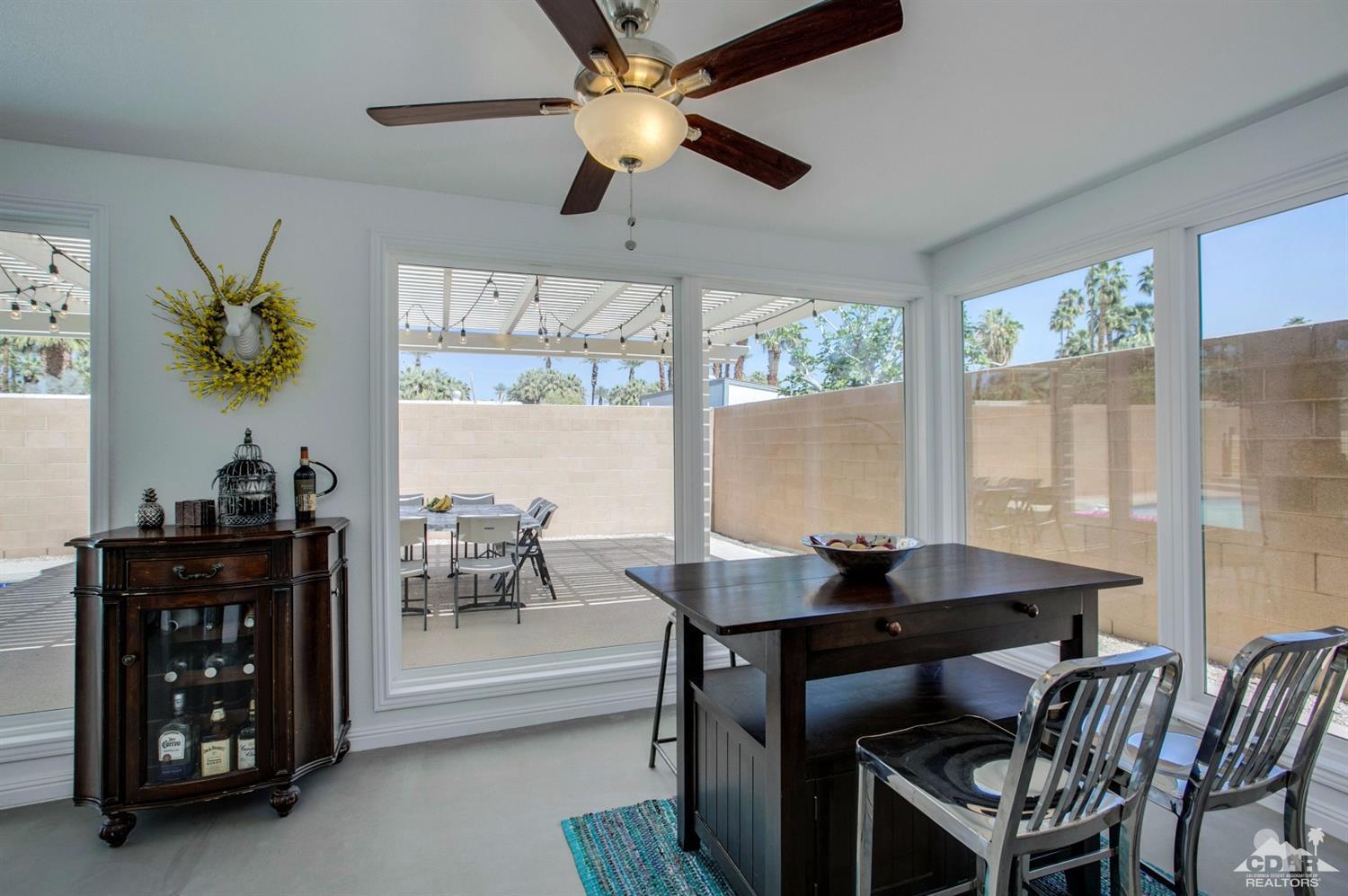 70070 Chappel Road Rancho Mirage, CA 92270 - Photo 13 of 32 a dining room with furniture and window