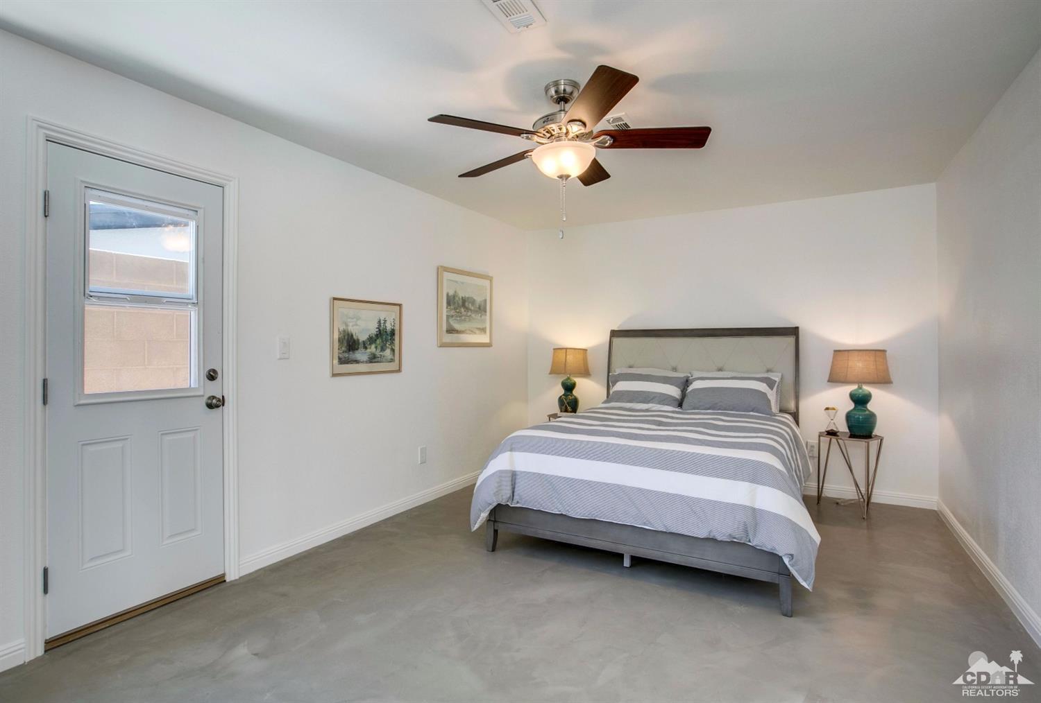 70070 Chappel Road Rancho Mirage, CA 92270 - Photo 21 of 32 a bedroom with a bed and window