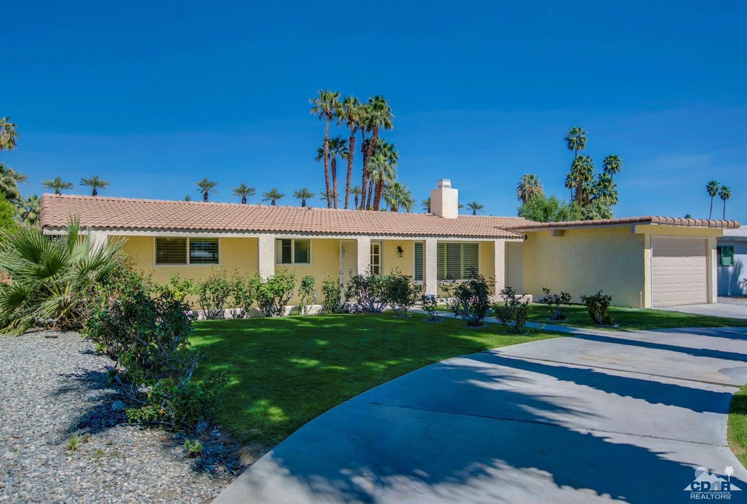 70070 Chappel Road Rancho Mirage, CA 92270 - Photo 3 of 32 a front view of a house with a yard
