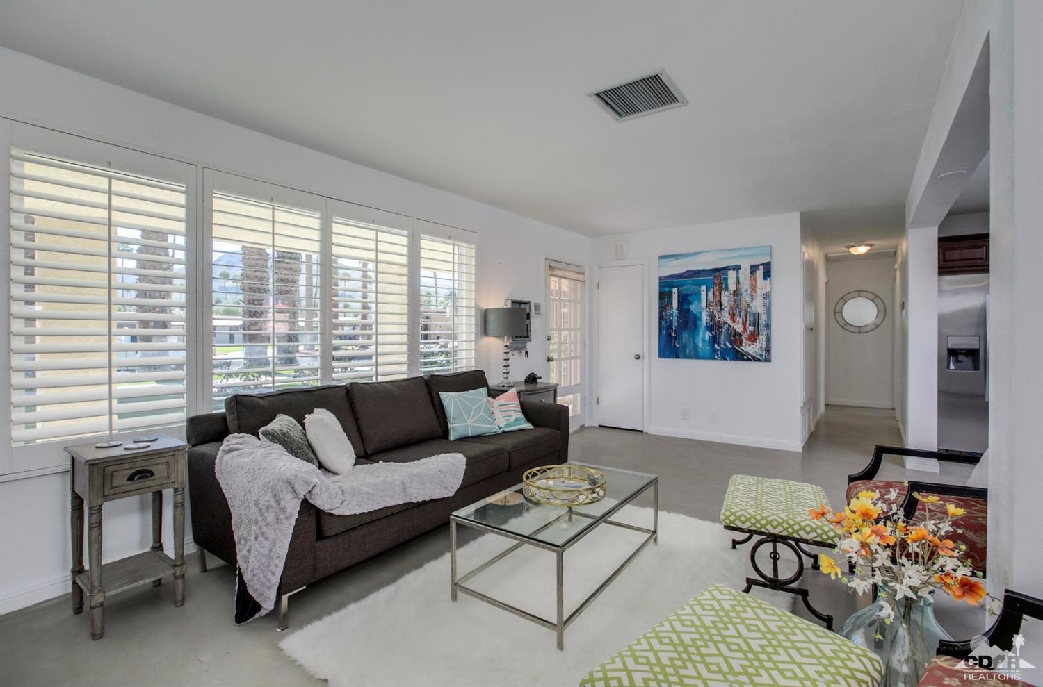 70070 Chappel Road Rancho Mirage, CA 92270 - Photo 5 of 32 a living room with furniture and a large window