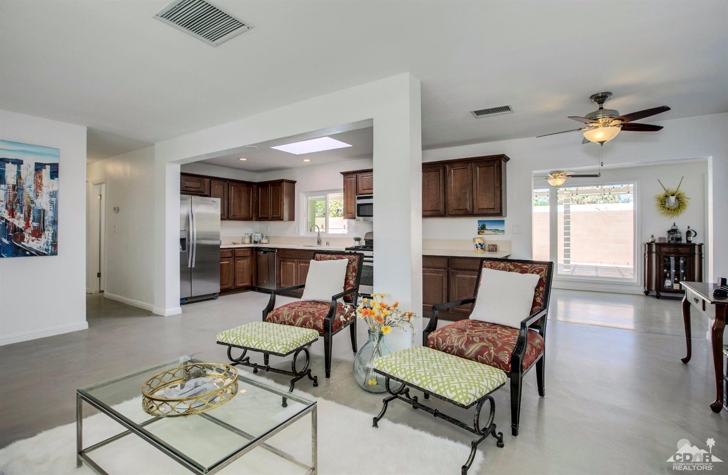 70070 Chappel Road Rancho Mirage, CA 92270 - Photo 8 of 32 a living room with furniture and a flat screen tv