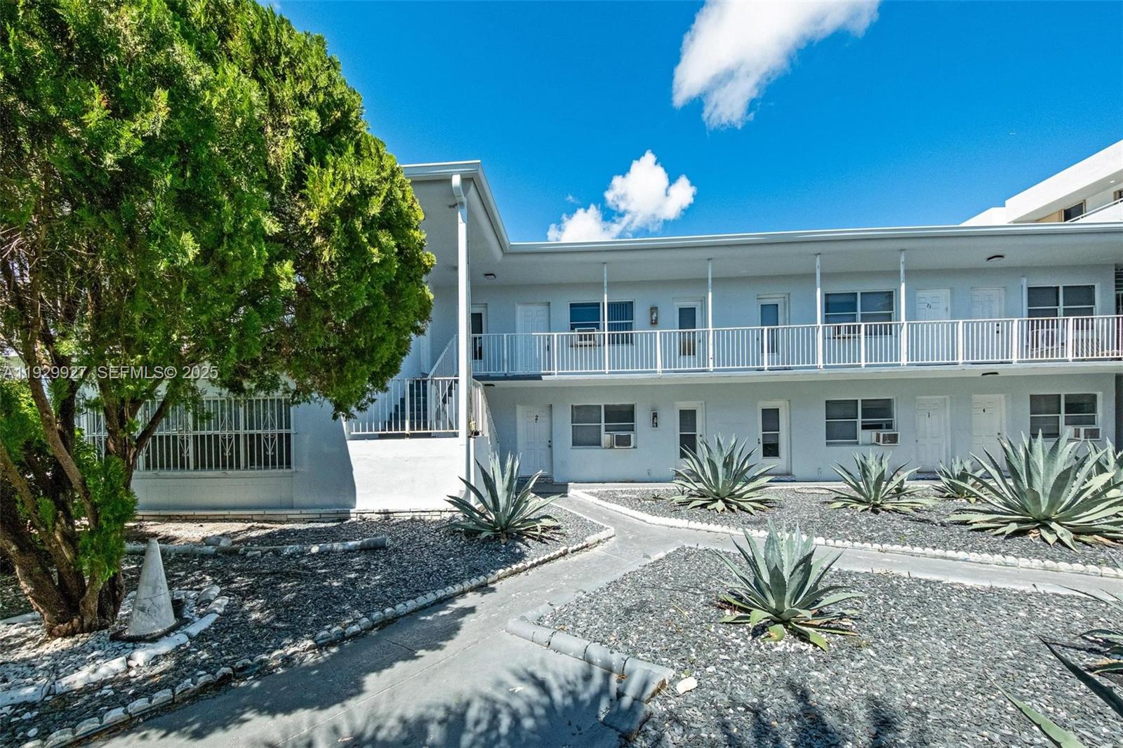 7271 Gary Avenue, Unit 6 Miami Beach, FL 33141 - Photo 21 of 23 a front view of a house with garden