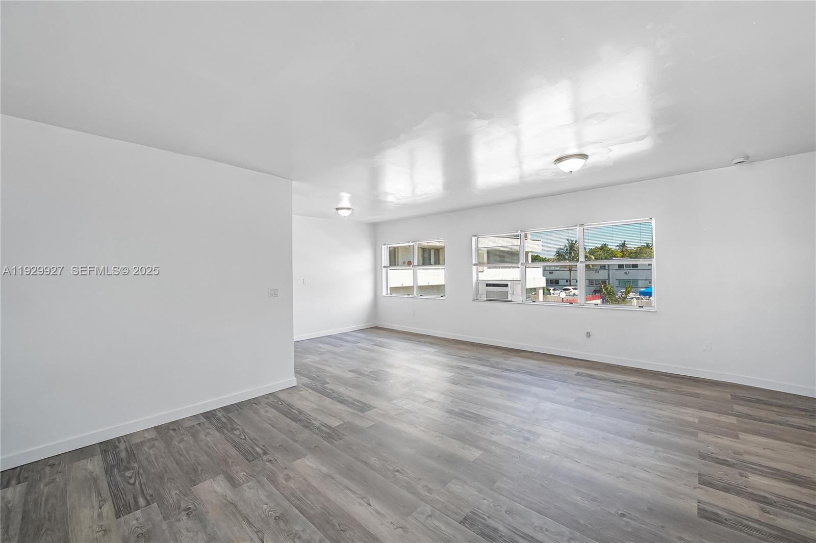7271 Gary Avenue, Unit 6 Miami Beach, FL 33141 - Photo 3 of 23 wooden floor in an empty room