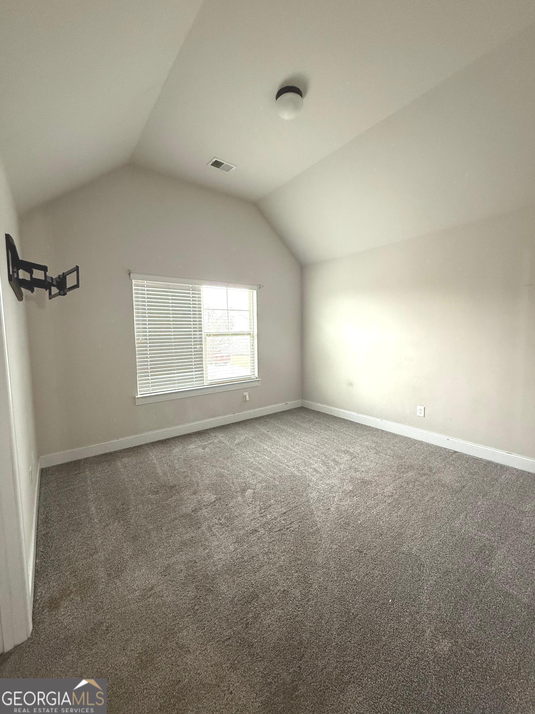 9159 Dover Street Lithia Springs, GA 30122 - Photo 13 of 23 a view of an empty room with a window