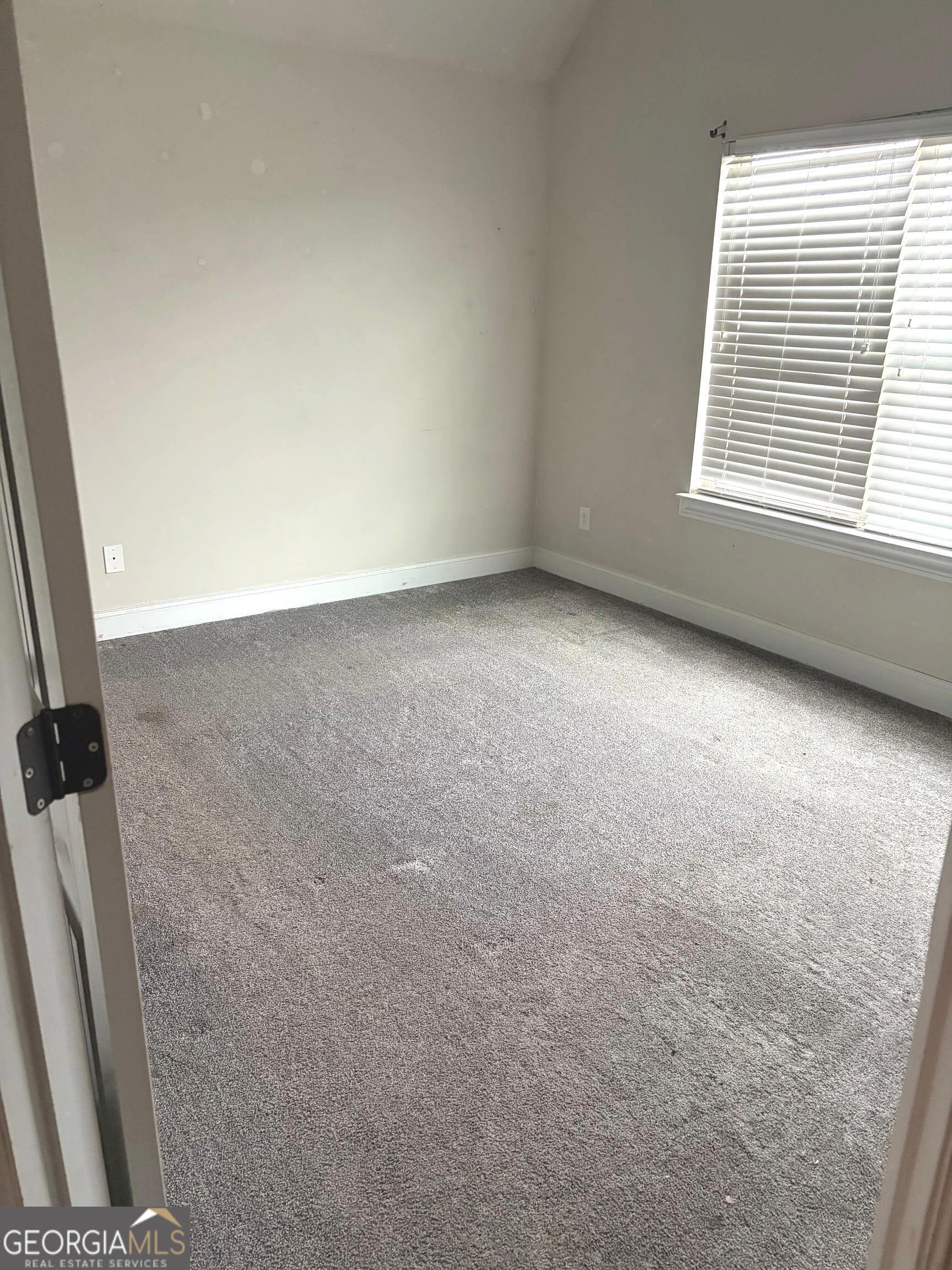 9159 Dover Street Lithia Springs, GA 30122 - Photo 16 of 23 an empty room with windows