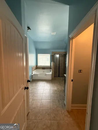 a view of wooden floor and windows in a room