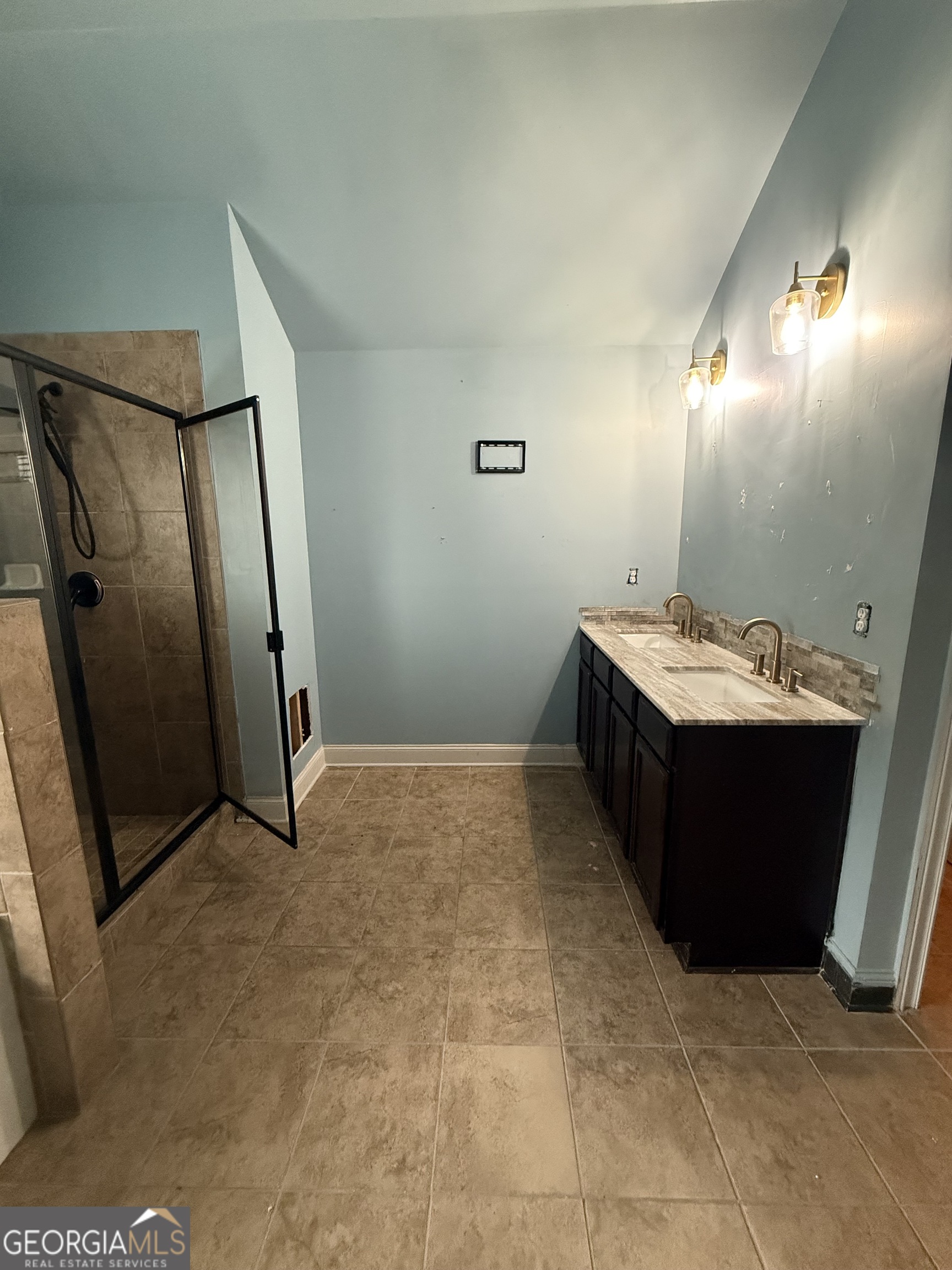 9159 Dover Street Lithia Springs, GA 30122 - Photo 23 of 23 a bathroom with a sink and mirror