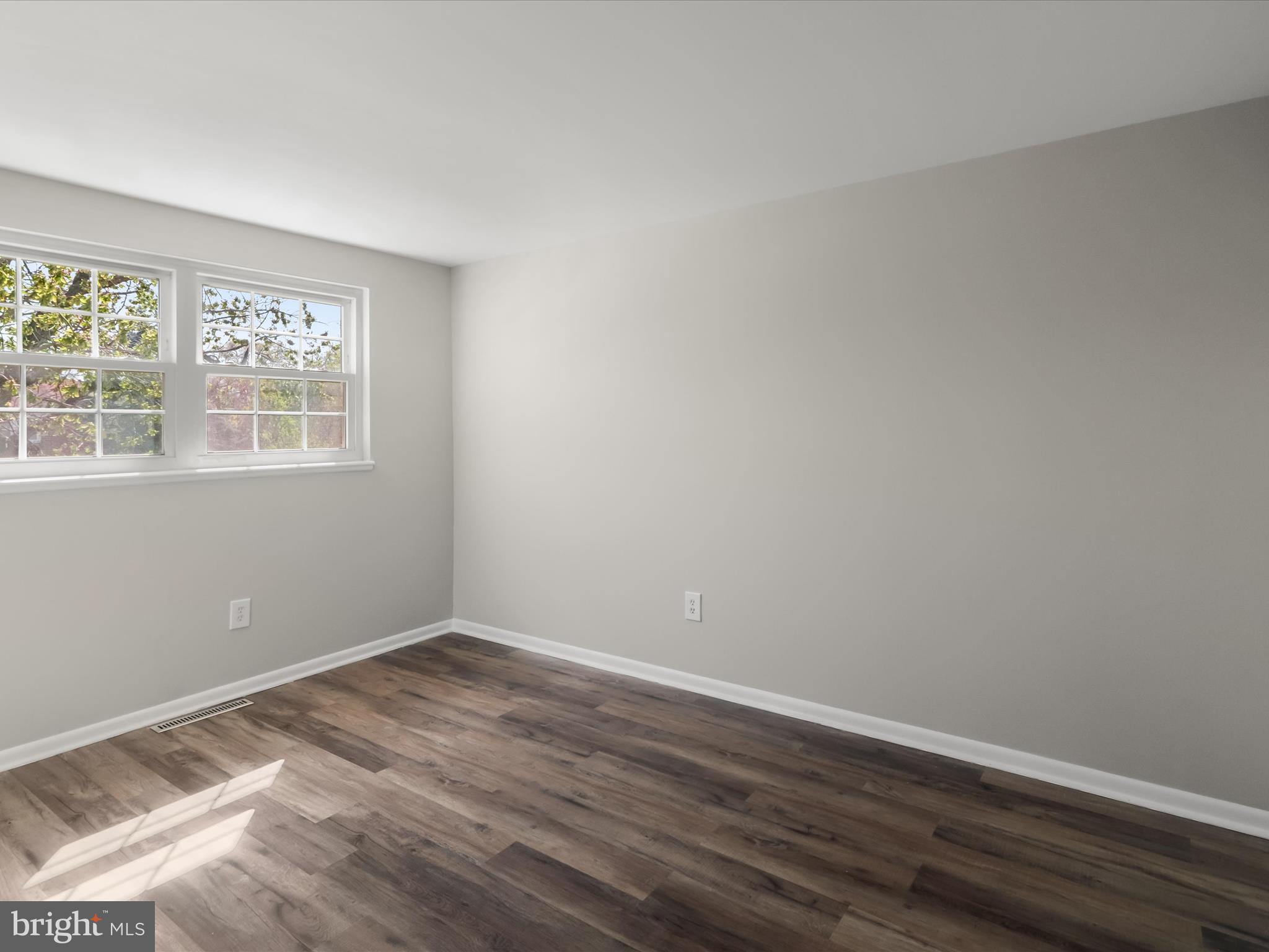 1026 Circle Drive Halethorpe, MD 21227 - Photo 24 of 37 wooden floor in an empty room with a window