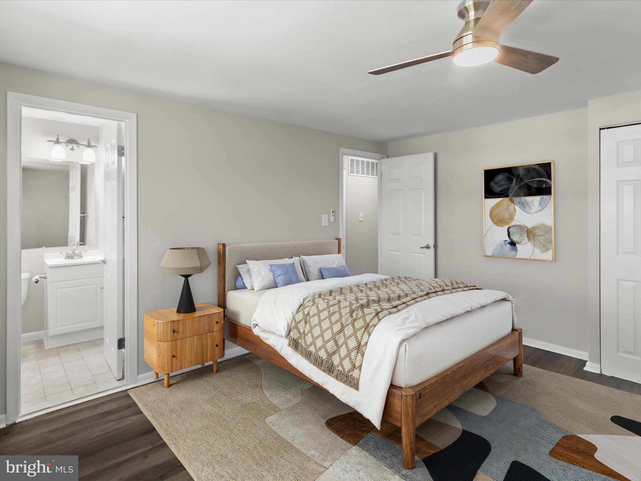 1026 Circle Drive Halethorpe, MD 21227 - Photo 6 of 37 a bedroom with a bed and a chandelier