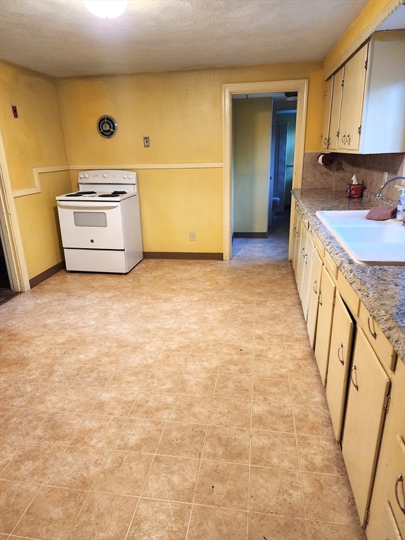 92 Lexington Road Billerica, MA 01821 - Photo 5 of 10 a view of a kitchen with storage and utility