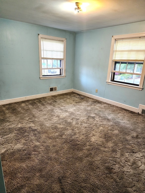 92 Lexington Road Billerica, MA 01821 - Photo 6 of 10 an empty room with windows