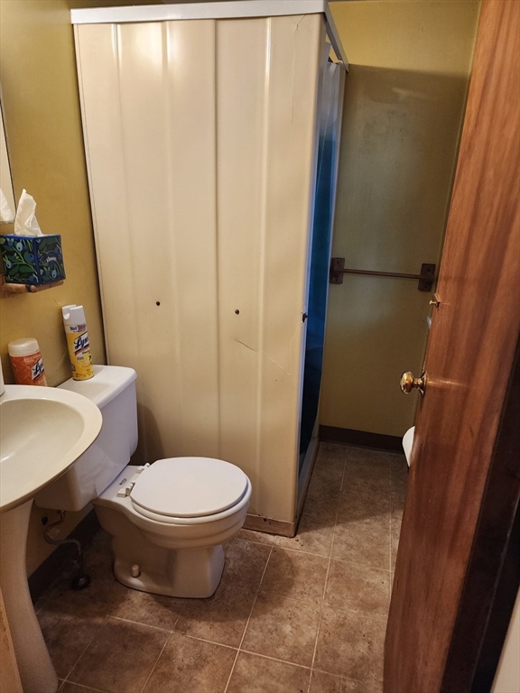 92 Lexington Road Billerica, MA 01821 - Photo 7 of 10 a bathroom with a sink and a toilet