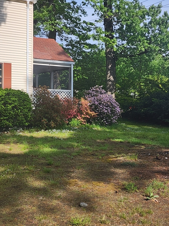 92 Lexington Road Billerica, MA 01821 - Photo 9 of 10 a front view of a house with a yard