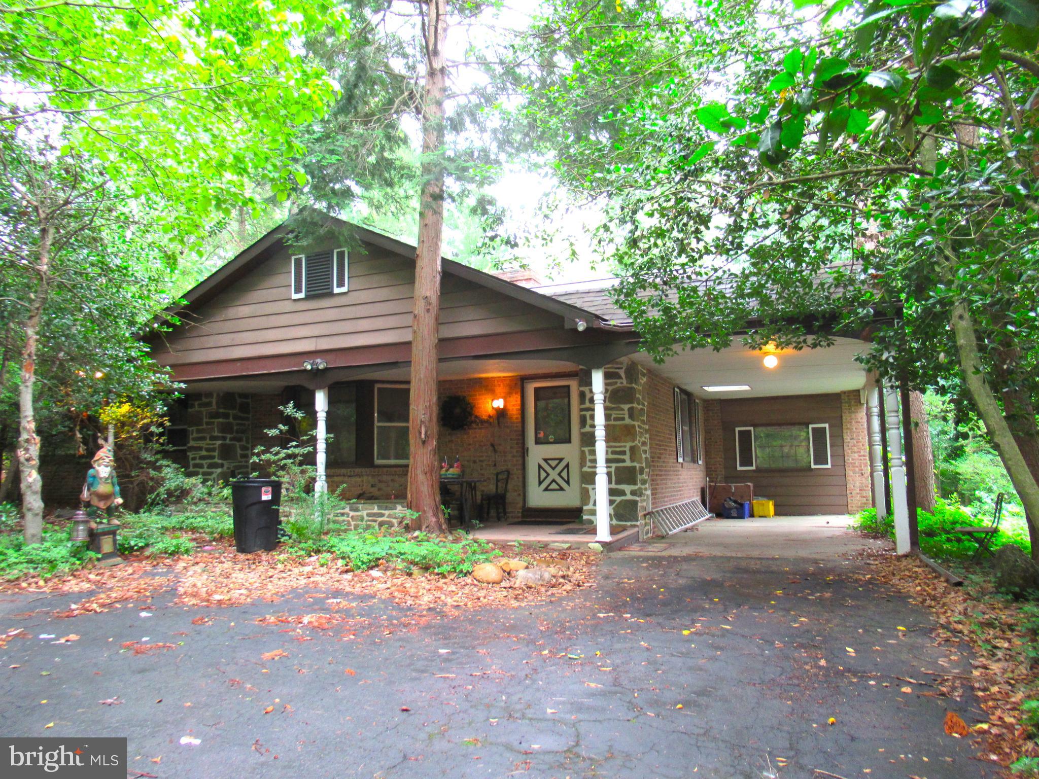 3227 Pine Road Huntingdon Valley, PA 19006 - Photo 1 of 1 a front view of a house with a yard and potted plants