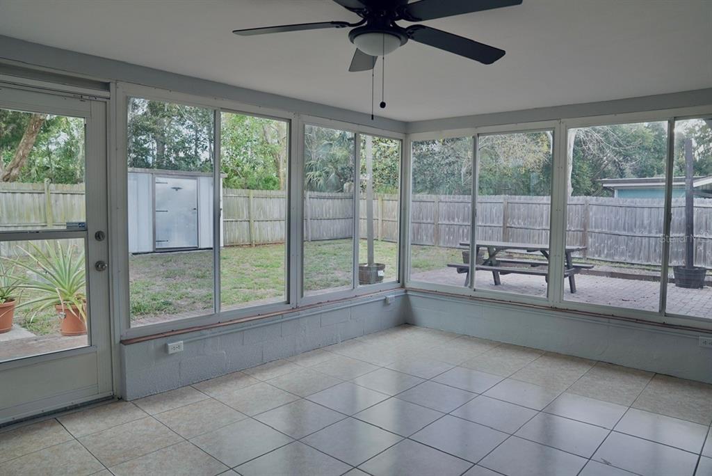 7944 Yucca Drive New Port Richey, FL 34653 - Photo 16 of 26 a view of a room with window and a ceiling fan