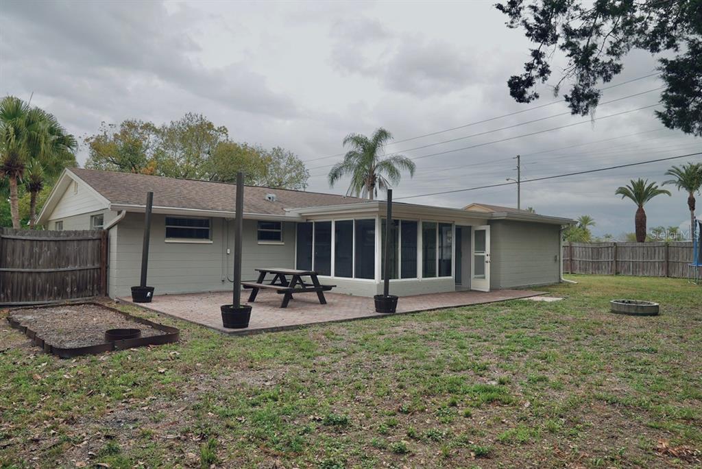 7944 Yucca Drive New Port Richey, FL 34653 - Photo 18 of 26 a front view of a house with garden