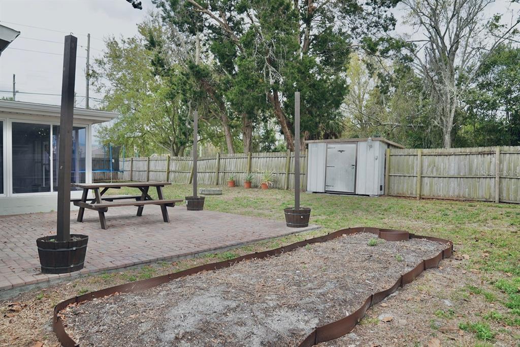7944 Yucca Drive New Port Richey, FL 34653 - Photo 23 of 26 a view of a backyard with swings